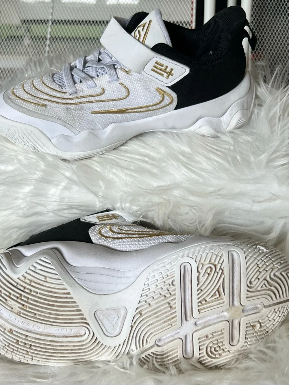 Nike Kids White and Black Sneakers with Gold Accents